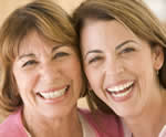 Happy Mother & Daughter Who Enjoy Breast Health