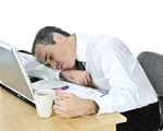 Man Asleep at Desk