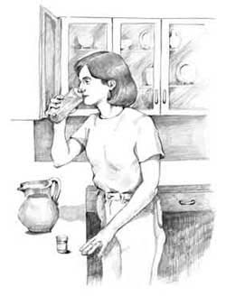 Woman drinking a water-fiber mixture.